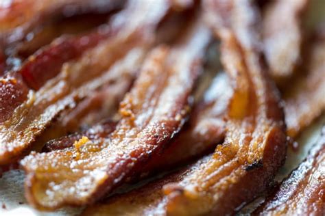 After baking bacon in the oven, pat any excess grease to help it get crisp. How Long to Bake Bacon? - Food Fanatic