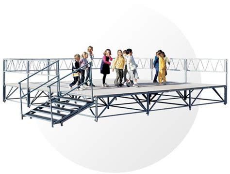 A Group Of People Walking Across A Bridge Over Looking At The Camera On