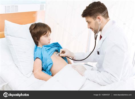 Doctor Examining Child Patient Stock Photo By ©sergillin 142844337