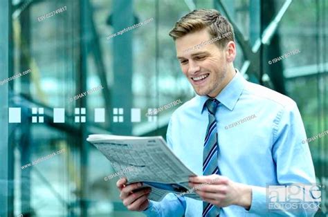 Handsome Businessman Reading A Newspaper Stock Photo Picture And Low