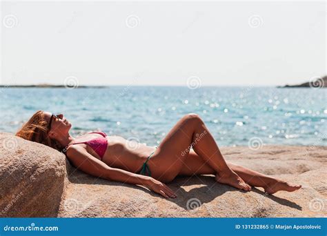 Young Woman Tanning On The Beach Stock Image Image Of Beauty Remote 131232865