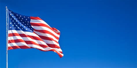 American Flag Waving In Blue Sky Stock Photo Download Image Now Istock
