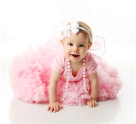 Baby Girl Wearing Pettiskirt Tutu And Pearls — Stock Photo © Teraberb