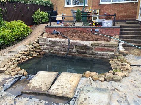 You'll need a jigsaw to cut the curved trellis parts. Pond with granite retaining wall and waterfall by JDM ...