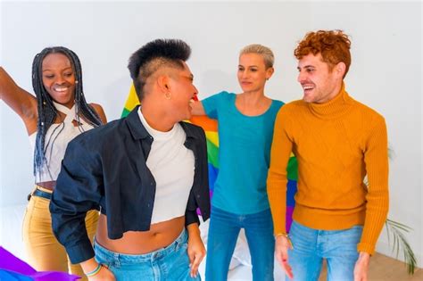 premium photo lgbt pride lgbt rainbow flag group of friends dancing and having fun in a house