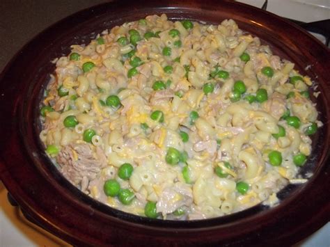 Season with salt and pepper. homeade tuna noodle casserole. Elbow mac. noodles, can of cream of mushroom soup, milk, canned ...