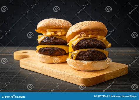 Hamburger Or Beef Burgers With Cheese And French Fries Stock Photo
