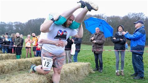 Uk Wife Carrying Contest Takes Place In Dorking Bbc News