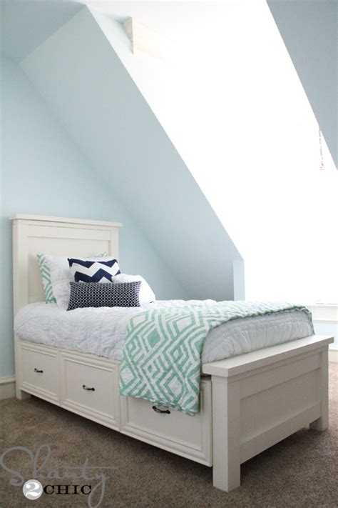 Here, the baseboard provides storage with stacked drawers. DIY Planked Headboard - Shanty 2 Chic