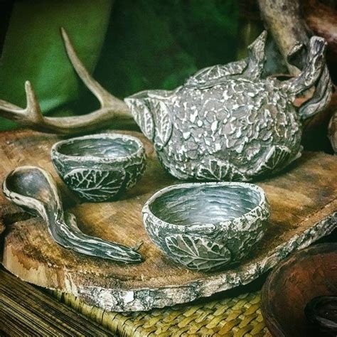 Some Silver Dishes Are Sitting On A Wooden Tray