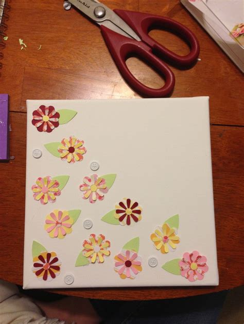 Another Canvas With Scrapbook Paper Flowers Hot Glued On It For Mother