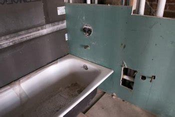 Some type of wall board, like drywall if you have a larger area, break the tiles with a hammer and chisel or sledgehammer to get them off the drywall. How to Remove a Tub to Install a Shower | Home Guides | SF ...