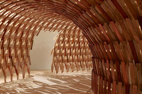 A Curved Pavilion Designed By Kengo Kuma Weaves Wooden Slats Into A