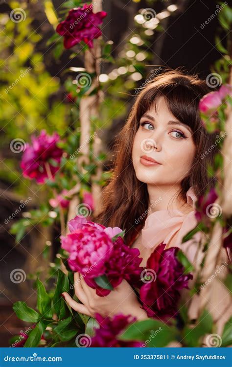 fabulous a beautiful and gentle woman in peony flowers feminine beauty stock image image of