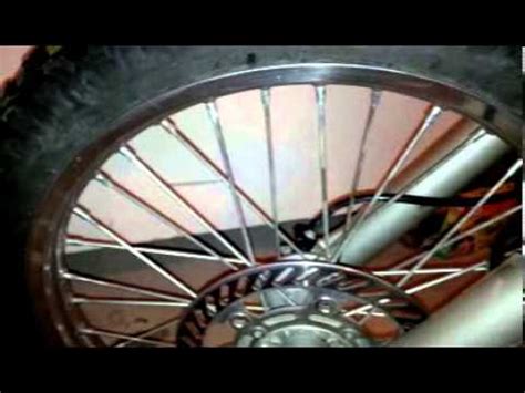 To tighten spokes, you don't actually turn the spoke. Dirt bike Maintenance KDX220 Spokes Tightening 3 - YouTube