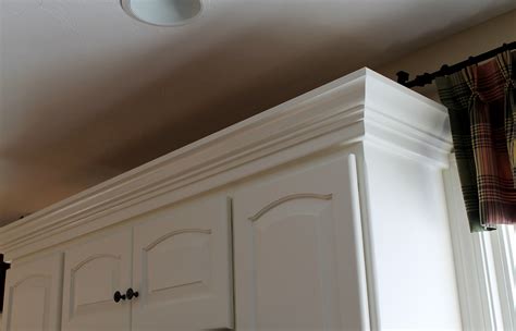 Mount the crown molding to the cabinet using the brad nailer. Kitchen Cabinets - Crown Molding Is A Must! - Hubley Painting