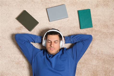 Man Listening To Audiobook On Floor Stock Photo Image Of Male
