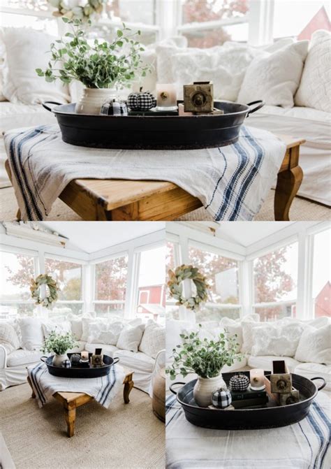 It's crafted from reclaimed solid birch wood in a distressed wood grain that contrasts nicely against four metal legs. A Farmhouse Style Coffee Table In The Sunroom