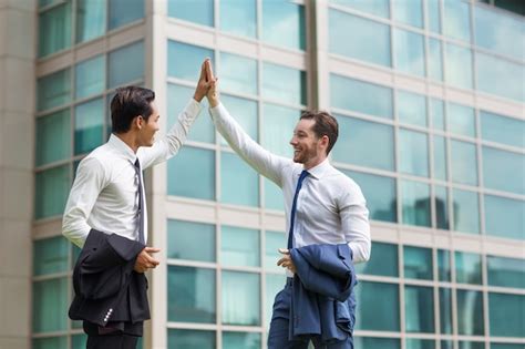 Two Happy Adult Business Men High Fiving Photo Free Download