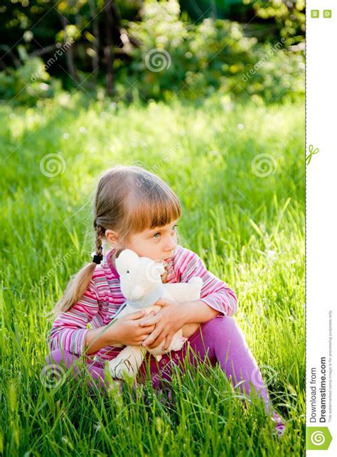 Sad Little Girl Alone On Outside The Home Stock Photo