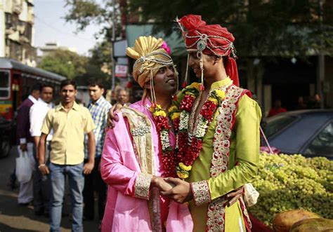 Gay Activists Dressed As Newly Wed Grooms Attend A Gay Pride Parade