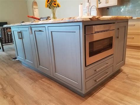 Most kitchen islands are formed with the same cabinetry used in the rest of the kitchen. Something we are seeing a lot of is a base microwave ...