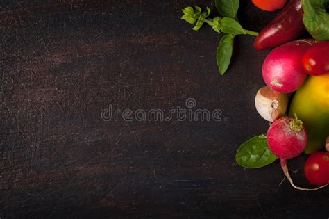 Various Vegetables And Herbs On Dark Wood Table Stock Image Image Of