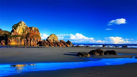 Nice Beautiful View Of Rock Mountains And Blue Sea Under Blue Sky Hd