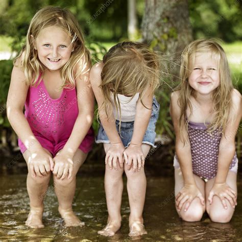 Smiling Girls Playing In Lake Stock Image F004 4959 Science Photo Library