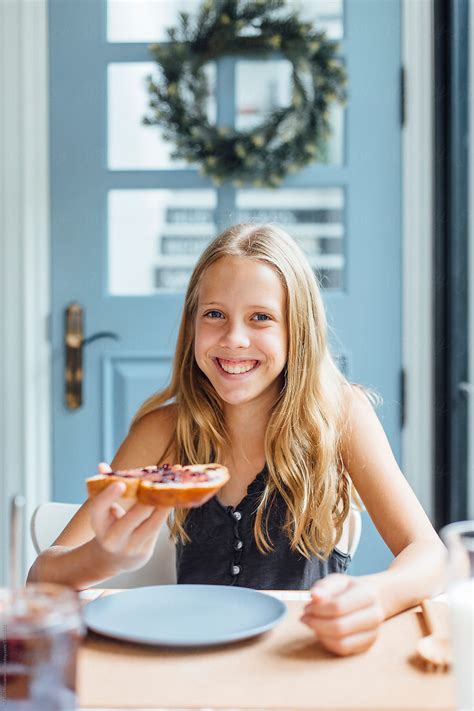 Young Girl Enjoying Breakfast By Stocksy Contributor Marko Stocksy