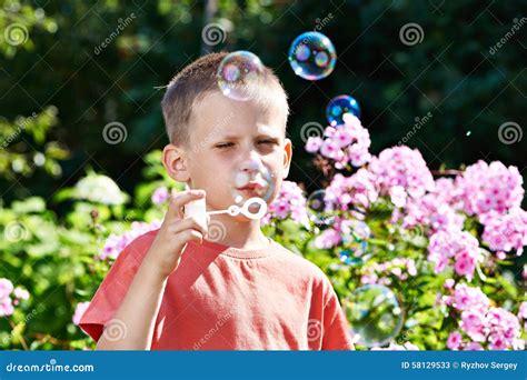 Little Boy Blowing Soap Bubbles Stock Image Image Of Garden Bubble