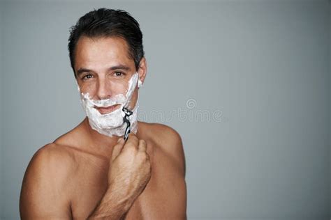 Starting The Day With A Shave Studio Portrait Of A Handsome Mature Man