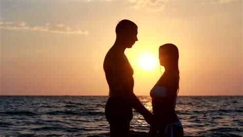 couple silhouette at the beach sunset light stock footage video 3599840 shutterstock