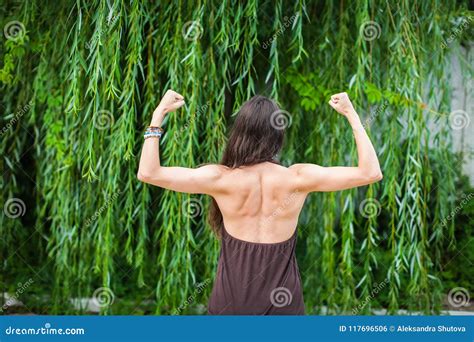 Beautiful Woman With Naked Back Over Green Weeping Willow Background