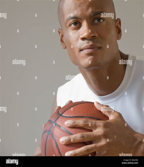 African Man Holding Basketball Stock Photo Alamy