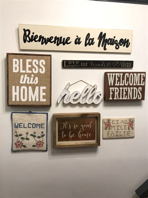 A Collage Wall Of Welcoming Signs Perfect For An Entryway These Are