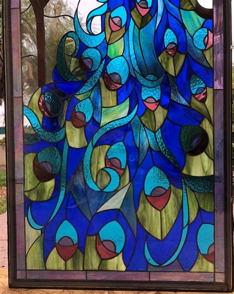 Consider a stained glass hanging with peacock designs across your doorway or a fireplace mantel for some glam and let the sunlight combine with the colors for some amazing aesthetic magic. Wow! Colorful Peacock Stained Glass Window Panel