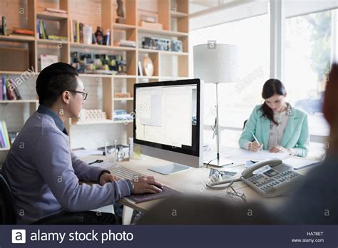 Architects Working At Computer In Office Stock Photo Alamy