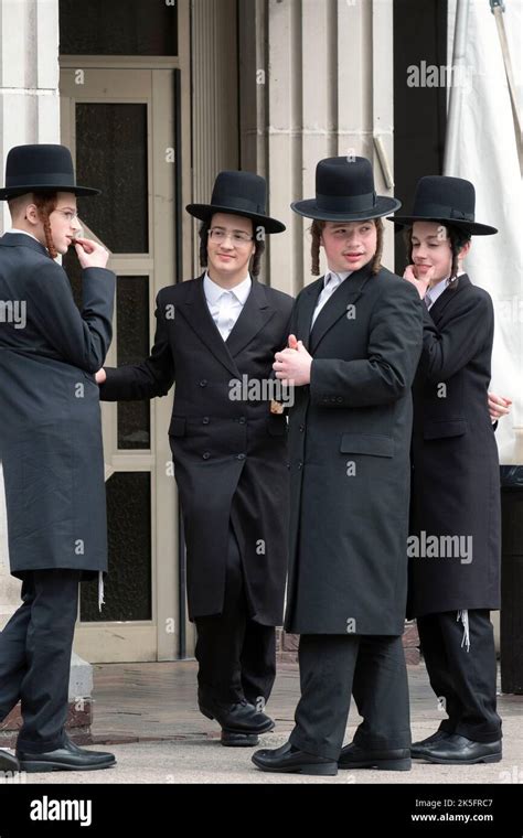 4 Hasidic Boys Dressed In Black Outside A Synagogue In Williamsburg