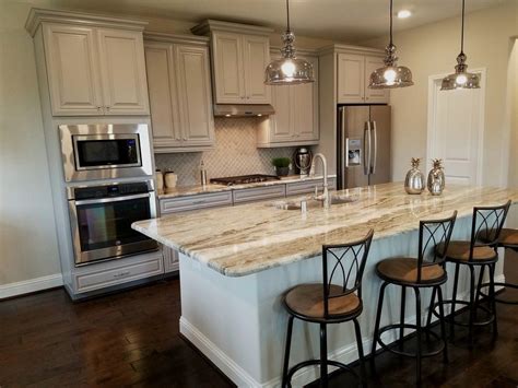 The baskets and brass serving dishes were found at a local market. Fantasy Brown granite and grey cabinets #beazerhomes ...