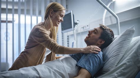 Wife Visiting Her Recovering Husband In The Hospital Stock Image
