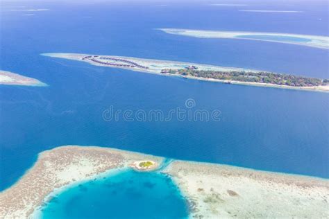 Maldives Aerial Panorama Blue Water Reef And Coral Islands Stock Photo