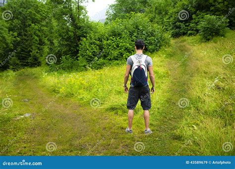 Young Man Facing Choice Between Two Different Path Royalty Free Stock