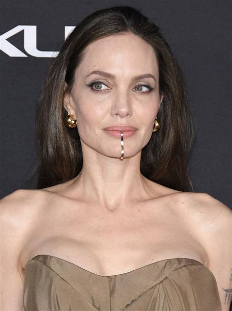 Angelina Jolie Turns Heads With Lip Cuff At Eternals Premiere