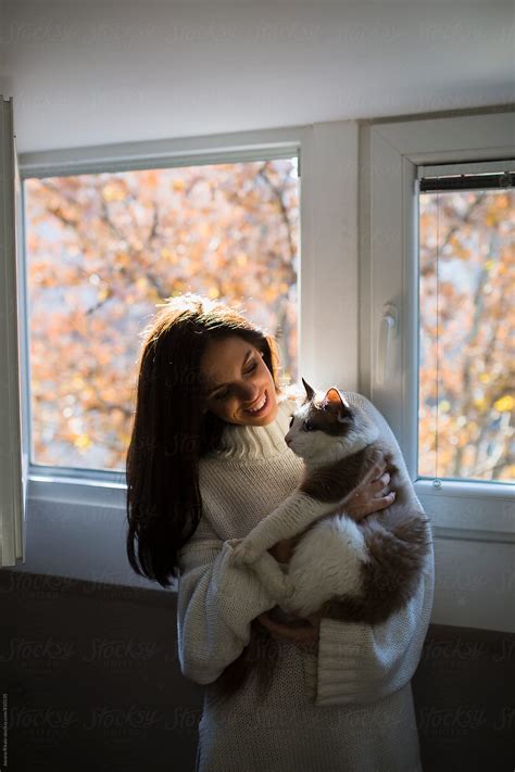 Young Woman Holding Her Cat By Stocksy Contributor Jovana Rikalo