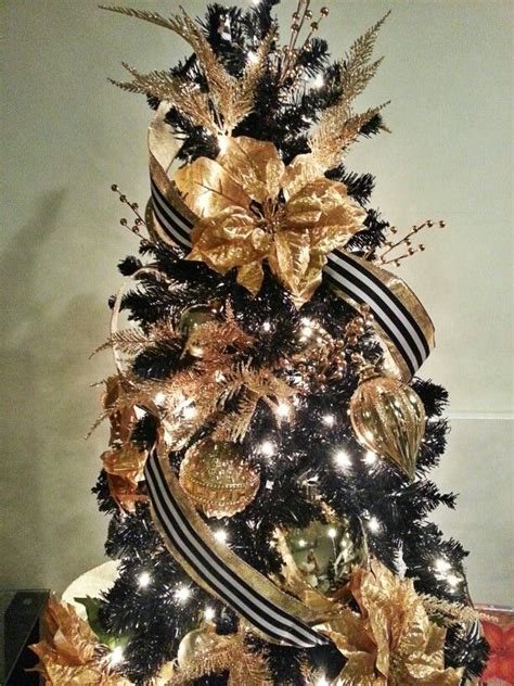 Such trees look as if they are covered with snow and white frost, some of them more and others less. Elegant Black and Gold Christmas Tree #blackchristmastree ...