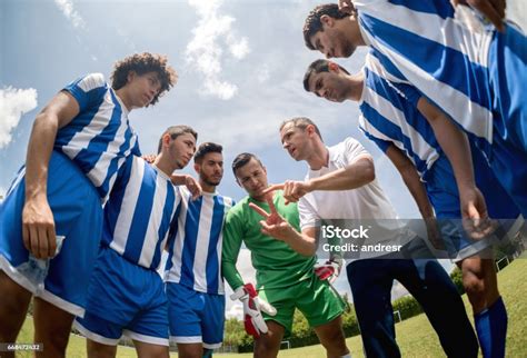 Coach Talking To A Group Of Soccer Players Stock Photo Download Image