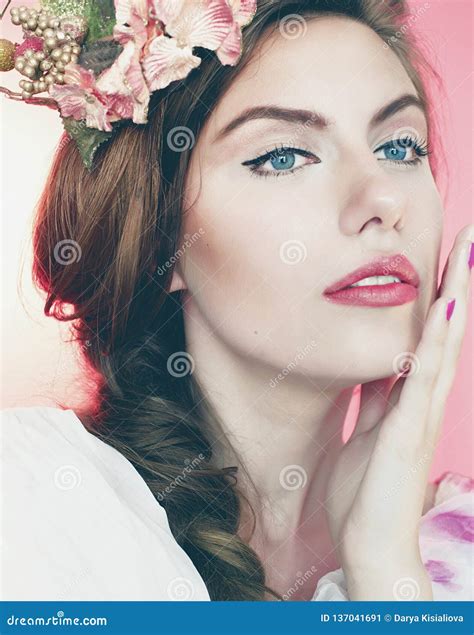 Beautiful Young Woman With Delicate Flowers In Their Hair Stock Image