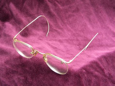 old gold rimless spectacles or eyeglass frames vintage bausch and lomb