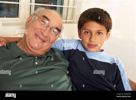 Portrait Of A Grandfather Smiling With His Grandson Stock Photo Alamy